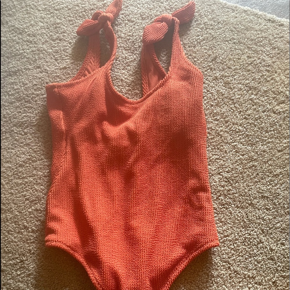 Orange one piece suit. Brand new
